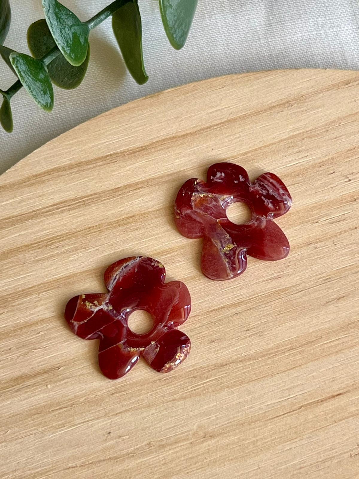 Flora mármol burdeos