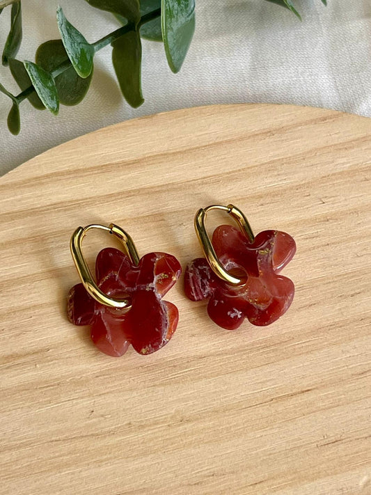 Flora mármol burdeos